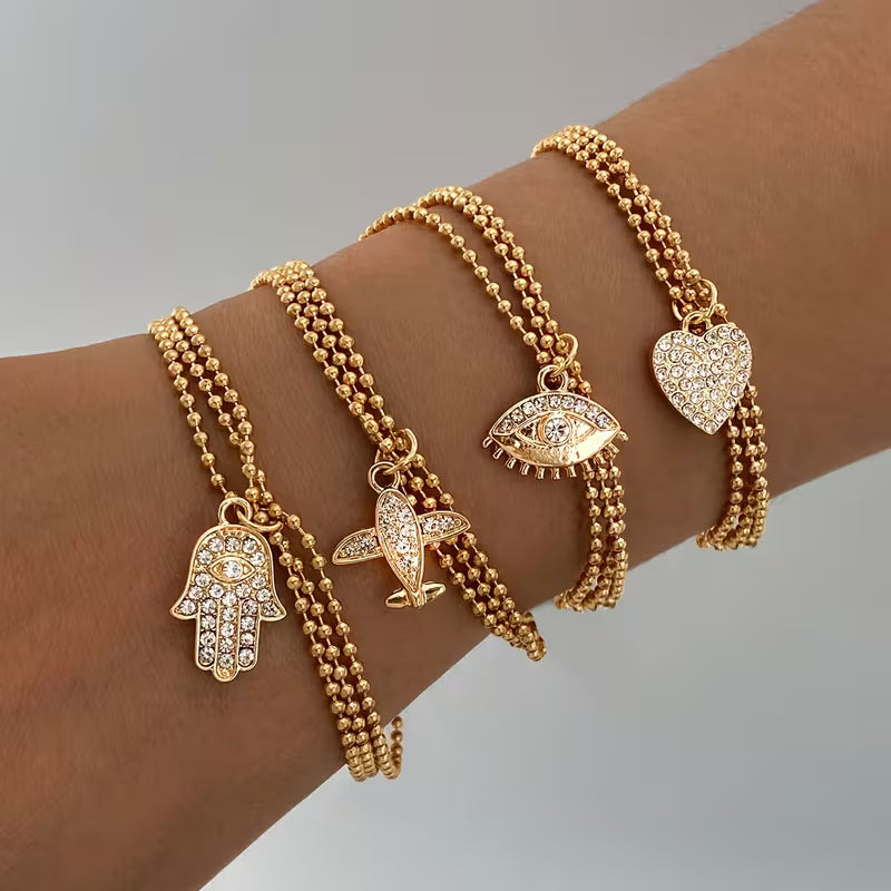 Triple strand with charm