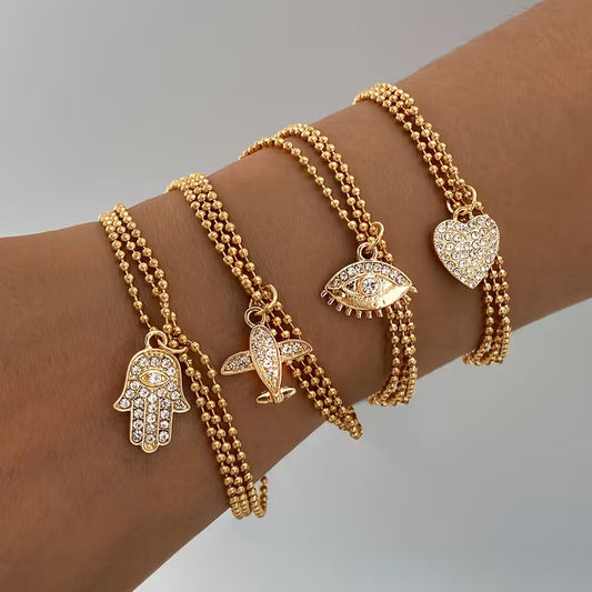 Triple strand with charm